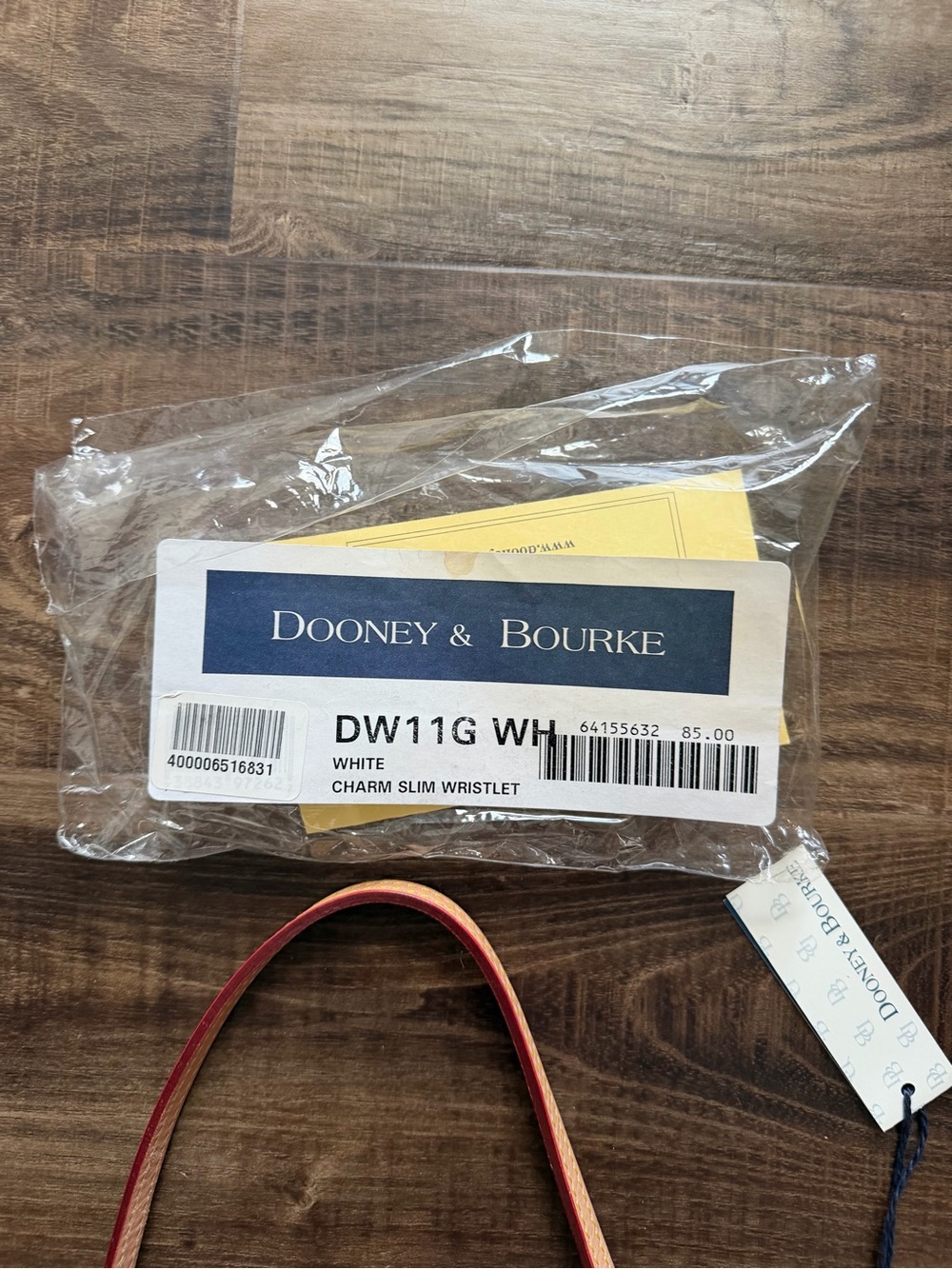 Dooney & Bourke Disney Cream Wristlet w/ Multicolor Charm Print, Like New w/tags - Picture 6 of 7